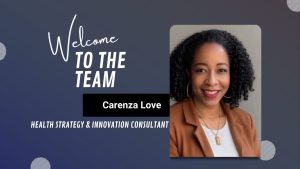 Welcome announcement graphic for Carenza Love joining as Health Strategy & Innovation Consultant. The design features a dark background with light blue and white circular patterns. Text on the left reads 'Welcome TO THE TEAM' and 'Carenza Love, HEALTH STRATEGY & INNOVATION CONSULTANT.' On the right is a blurred photo of Carenza Love wearing a brown blazer, light top, and gold jewelry.