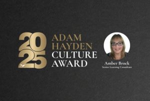 2025 Adam Hayden Culture Award presented to Amber Brock, Senior Learning Consultant, with gold stars on black background.